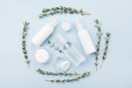 Set of organic natural cosmetic decorated with green eucalyptus leaf top view. Flat lay style.の写真素材
