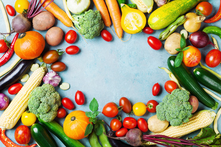 Food background with autumn farm vegetables and root crops top view. Healthy and organic harvest.の写真素材