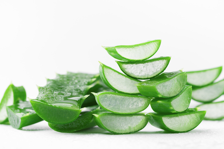 Aloe vera leaf with water droplets on white background.の写真素材