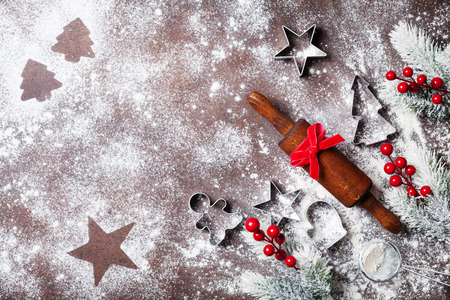 Christmas baking background with flour and rolling pin decorated with fir tree top view.の写真素材
