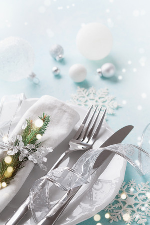 Christmas table setting for holiday dinner. Bokeh effect.の写真素材