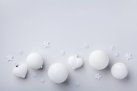 White Christmas decorations on pastel background top view. Christmas or New year holiday composition. Flat lay.の写真素材