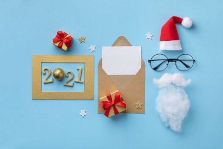 Happy New year 2021 or Christmas greeting card. Santa Claus face with hat, beard, glasses and gift...