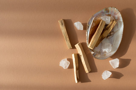 Palo Santo sticks with clear natural crystals in sea shell. Meditation, aromatherapy, mental health...