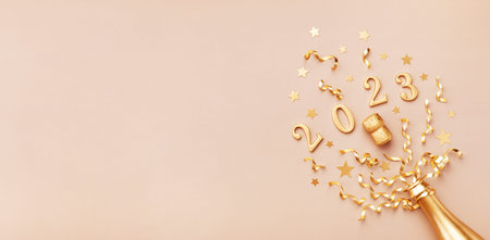 Festive Christmas and New Year background with golden champagne bottle, confetti stars, party...