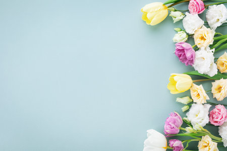 Festive composition for Happy mothers day. Spring colorful flowers on pastel blue background.の写真素材