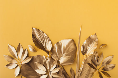 Golden leaves for design top view. Decoration painted elements for greeting cards, party and travel concept.の写真素材