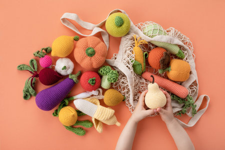 Children hands with cute knitting vegetables and fruits for activity, motor and sensory development....