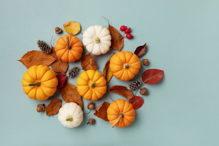 Autumn holiday background from pumpkins, colorful dried leaves and fall decorations. Happy thanksgiving day, harvest and halloween concept.の写真素材
