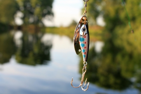Fishing lure on the green background of naturalの写真素材