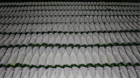 stacked up wine bottles in the cellar