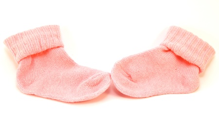 Pair of pink sock isolated on a white backgroundの写真素材