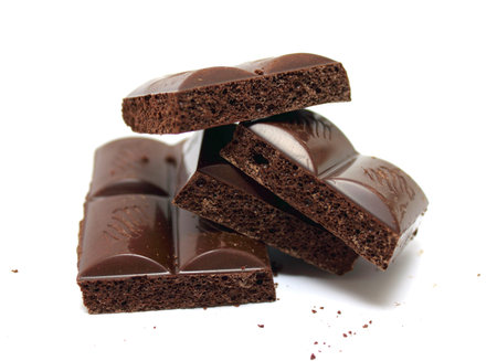 Broken chocolate bar on a white background