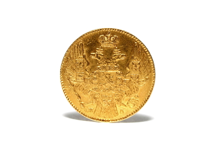 old gold coin isolated on a white background closeupの写真素材
