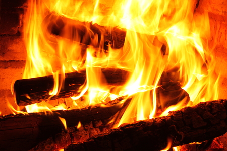 Fire in burning fireplace in winter close-upの写真素材