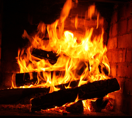 Fire in burning fireplace in winter close-upの写真素材