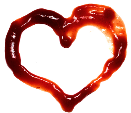 Abstract heart made of ketchup on white background closeup. Background Valentines Day. Valentines day ideas. Valentines day cards.の写真素材
