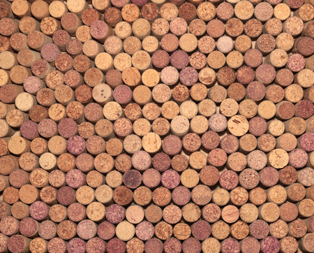 Wine corks background. Closeup of a wall of used wine corks. Different wine corks in background.の写真素材