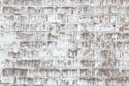 Old wall made of red brick, painted white in loft style for modern designer interior of room, bar or restaurantの写真素材
