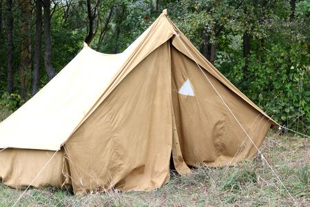 Old canvas tent in tourist camp in summerの写真素材