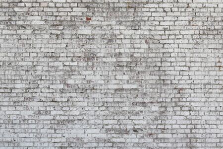 Old wall made of red brick, painted white in loft style for modern designer interior of room, bar or restaurantの写真素材