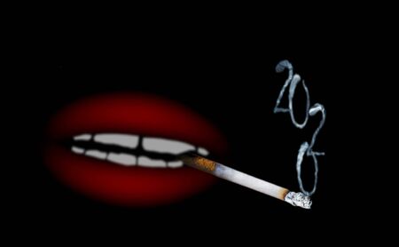 Abstract blurred image of cigarette with smoke in shape of inscription 2020 and red shapeless mouth on black background as abstract unusual christmas cardの写真素材