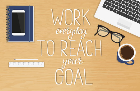 Work everyday to reach your goal motivational and inspirational handmade headline. Handwritten lettering quote on the realistic office desktop top view with laptop, diary and smartphone