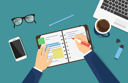 Businessman is writing down a note in the notebook or diaryのイラスト素材