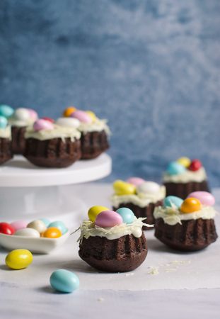 Mini Bundt Cakes Decorated with Chocolate Eggs, Easter Dessertの写真素材