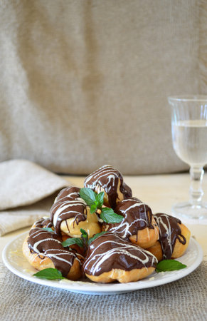 Profiteroles with dark and white chocolate