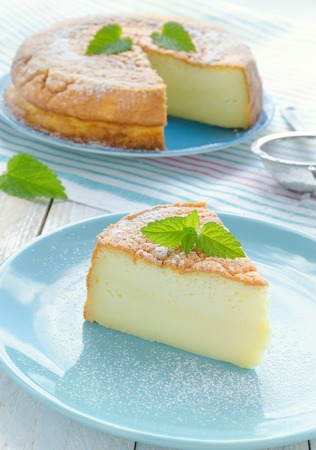 Japanese cheesecake decorated with mint and strawberryの写真素材