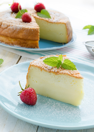 Japanese cheesecake decorated with mint and strawberryの写真素材