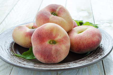 Saturn peaches or UFO, donut, flat peachesの写真素材