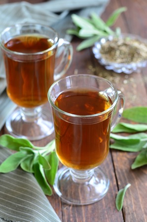 Sage tea on wooden backgroundの写真素材