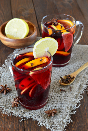 Mulled wine with orange on wooden backgroundの写真素材