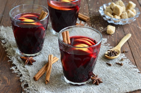 Mulled wine with lemon on wooden backgroundの写真素材