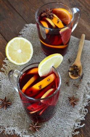 Mulled wine with orange on wooden backgroundの写真素材