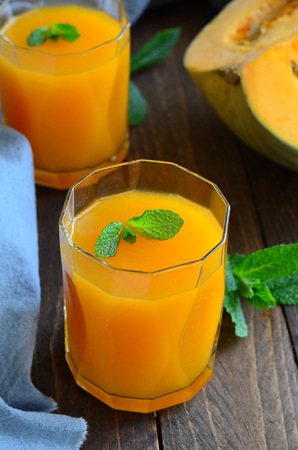 Pumpkin and Orange Drink on wooden backgroundの写真素材