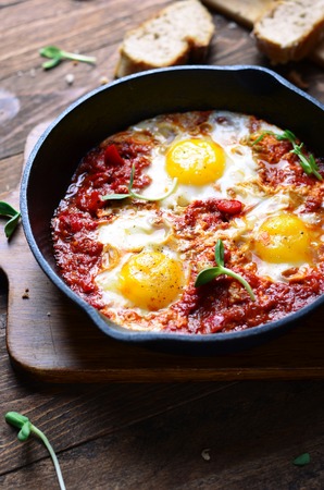 Shakshuka, Fried Eggs with Tomato Sauce in a Panの写真素材
