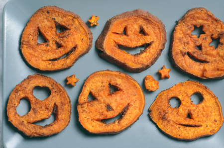 Roasted Sweet Potato Carving Funny Faces, Halloween Symbol Creative Food for Kidsの写真素材