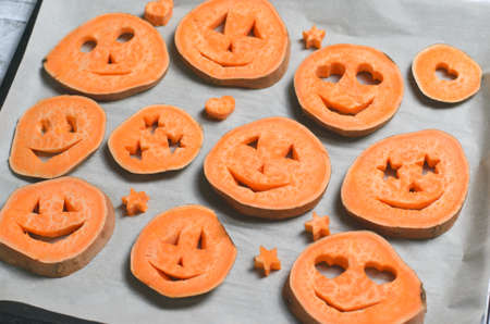 Sweet Potato Carving Funny Faces, Halloween Symbol Creative Food for Kidsの写真素材