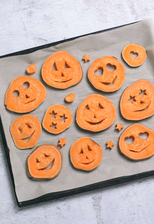 Sweet Potato Carving Funny Faces, Halloween Symbol Creative Food for Kidsの写真素材