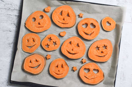 Sweet Potato Carving Funny Faces, Halloween Symbol Creative Food for Kidsの写真素材