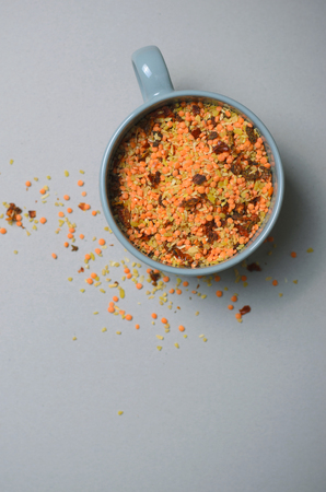Lentil and Bulgur Mix with Dried Herbs and Spices on Grey Backgroundの写真素材