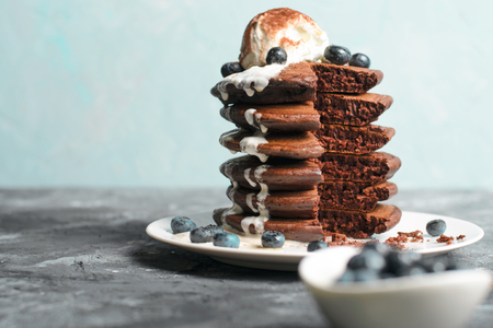 Chocolate Pancakes with Blueberry and Ice Cream on grey background, Homemade Dessert, Tasty Sweet Breakfastの写真素材