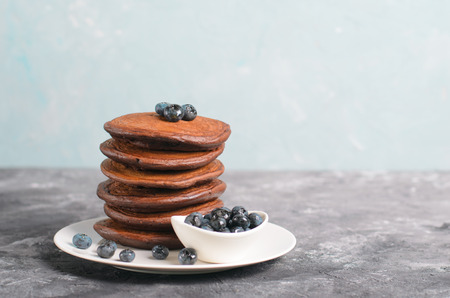 Chocolate Pancakes with Blueberry on grey background, Homemade Dessert, Tasty Sweet Breakfastの写真素材