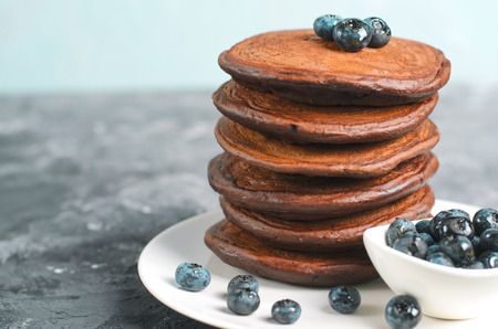 Chocolate Pancakes with Blueberry on grey background, Homemade Dessert, Tasty Sweet Breakfastの写真素材