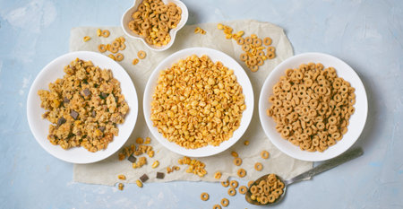 Different Kinds of Cereals, Quick Breakfast, Healthy Snacks, Puffed Rice, Cereal Loops and Chocolate Granolaの写真素材