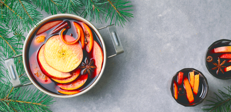 Mulled Wine, Hot Spiced Drink with Orange and Apple in a Vintage Pot, Winter Beverageの写真素材