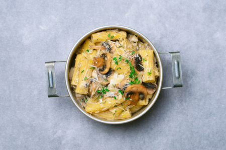 Creamy Mushroom Pasta with Fresh Thyme and Parmesan in a Vintage Pot, Italian Cuisineの写真素材